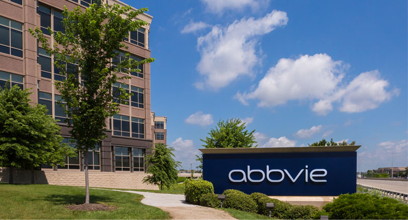 AbbVie building and sign in front of a blue sky.